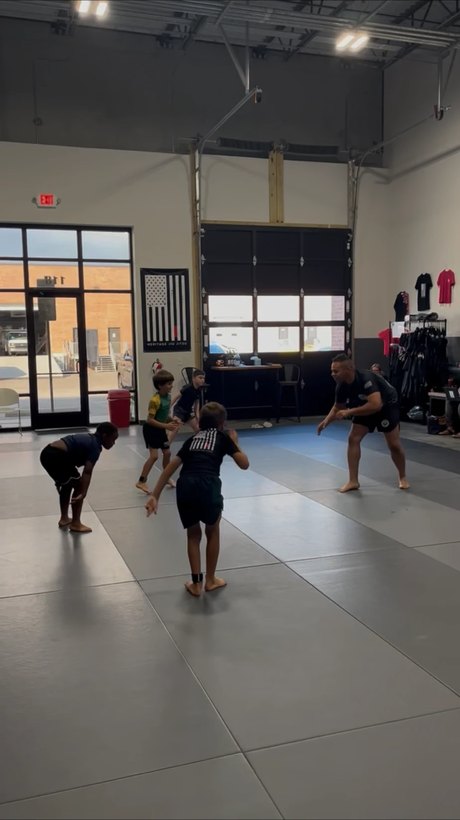 Coach AJ Hampstead on the mats