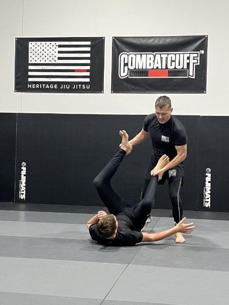Coach Eric Gillette coaching on the mats