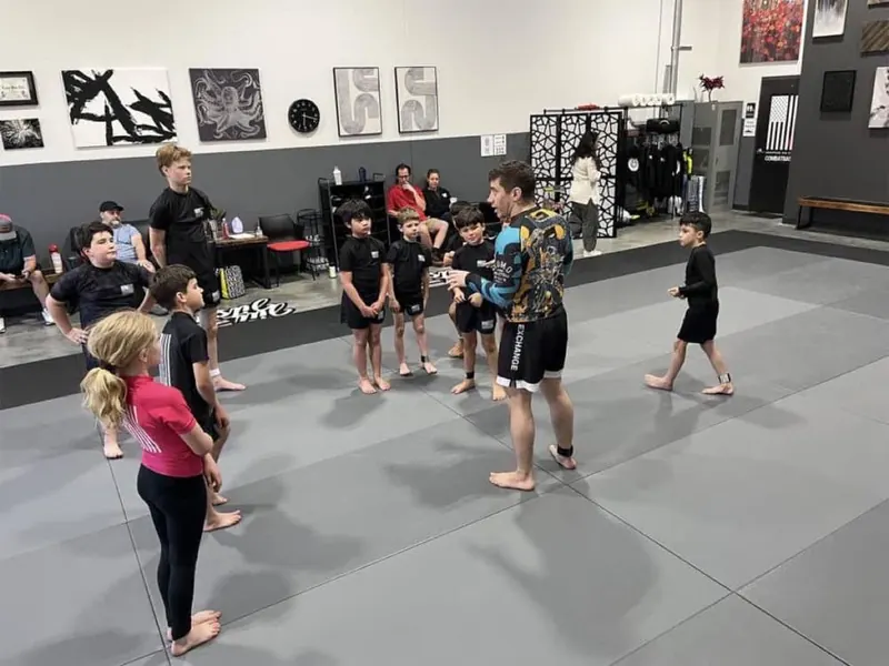 Coach Austin leading a kids no-gi class at Heritage Jiu Jitsu