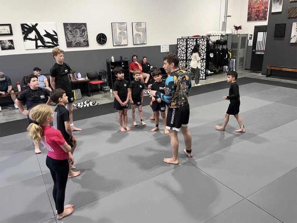 Coach Austin leading a kids no-gi class at Heritage Jiu Jitsu